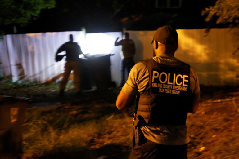 Secret Service and Homeland Security agents check a former home of a suspect named by news organizations as Ryan W. Routh