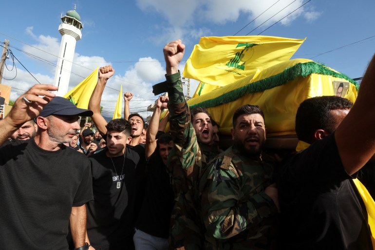 Mourners carry the coffin of Hezbollah member Ali Mohamed Chalbi, after hand-held radios and pagers used by Hezbollah detonated across Lebanon, during his funeral in Kfar Melki, Lebanon September 19, 2024. REUTERS/Aziz Taher