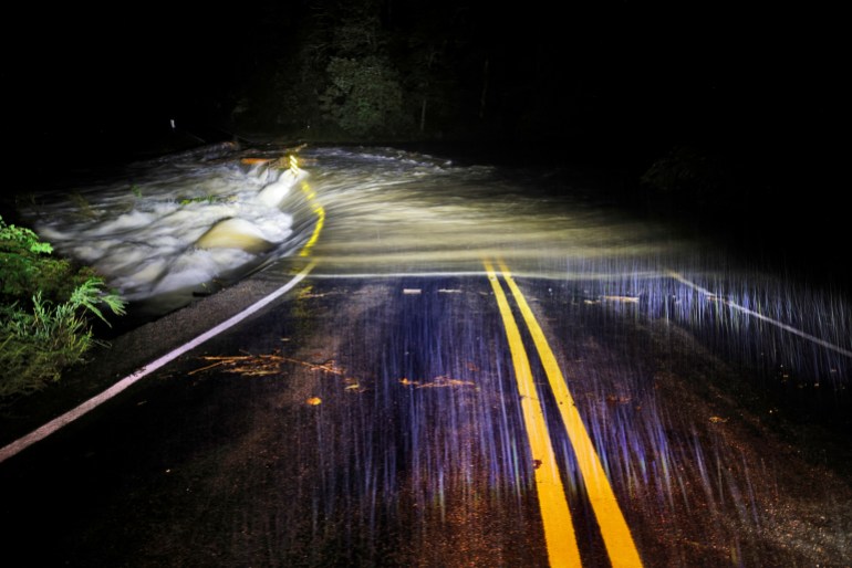 Flood waters wash over Guy Ford Road bridge 