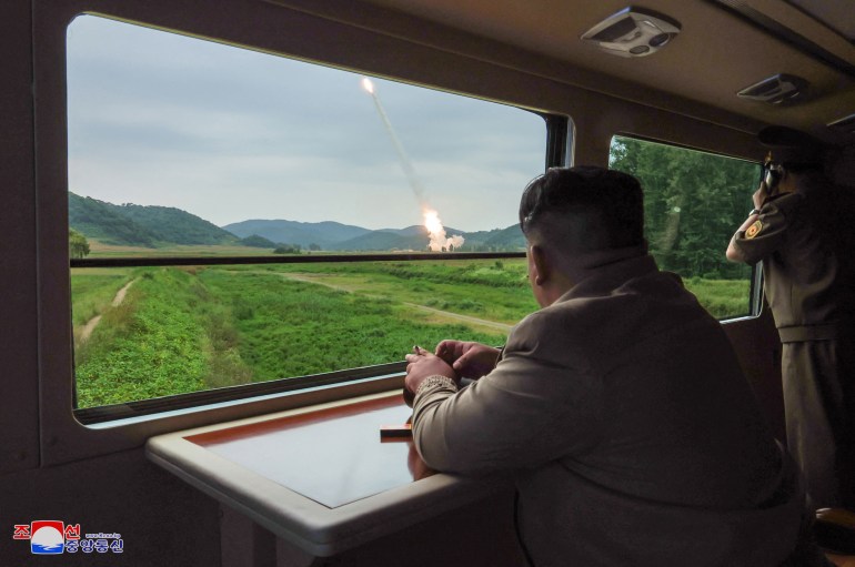 This undated photo released from North Korea's official Korean Central News Agency (KCNA) via KNS on September 13, 2024 shows North Korean leader Kim Jong Un (L) inspecting a test firing of a new-type 600mm multiple rocket launcher at an undisclosed location in North Korea. (Photo by KCNA VIA KNS / AFP) / SOUTH KOREA OUT / ---EDITORS NOTE--- RESTRICTED TO EDITORIAL USE - MANDATORY CREDIT "AFP PHOTO/KCNA VIA KNS" - NO MARKETING NO ADVERTISING CAMPAIGNS - DISTRIBUTED AS A SERVICE TO CLIENTSTHIS PICTURE WAS MADE AVAILABLE BY A THIRD PARTY. AFP CAN NOT INDEPENDENTLY VERIFY THE AUTHENTICITY, LOCATION, DATE AND CONTENT OF THIS IMAGE.