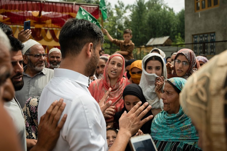  Waheed Para interacting with voters in his constituency Pulwama, south Kashmir, during his election campaign. [Abrar Fayaz/Al Jazeera]