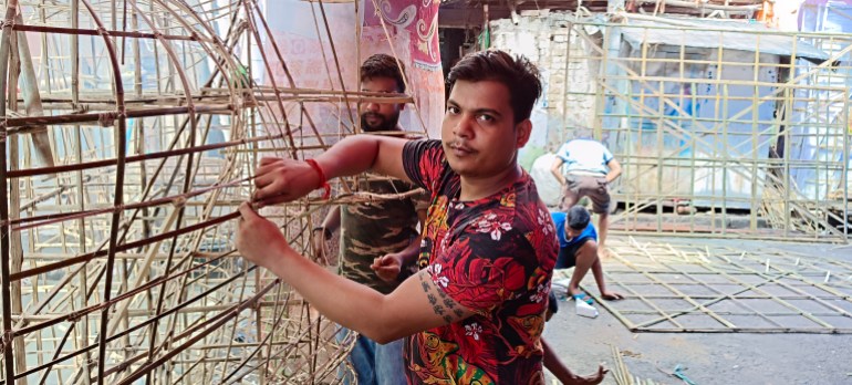 Prabhakar Porel who makes the bamboo structures for the pandals in Kolkata, India says the size of the structures have been scaled down