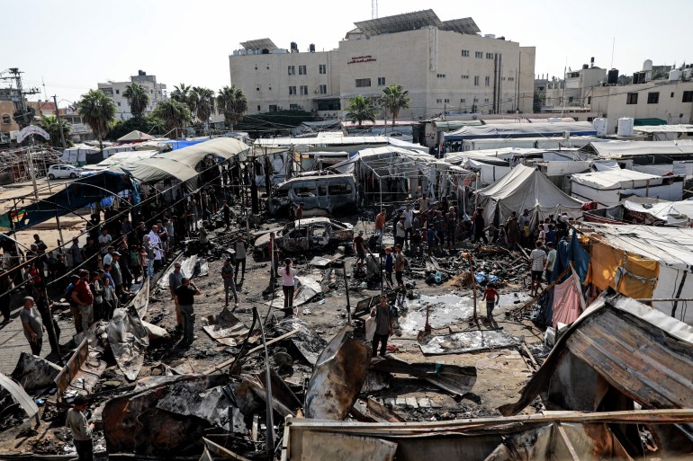 A shot of the destruction caused when Israel bombed a displaced people's camp in Deir el-Balah, Gaza. The camp was in the courtyard of the Al-Aqsa Martyr's Hospital