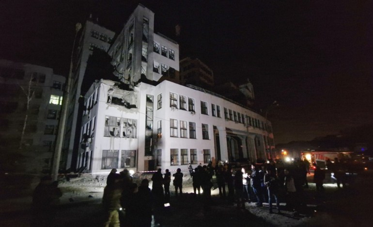 epa11689523 People look at damage after a Russian strike on the Derzhprom building in downtown Kharkiv, Ukraine, 28 October 2024, amid the Russian invasion. According to Governor Oleh Syniehubov, at least six people were injured after the attack. Built in 1928 in the constructivist style, the Derzhprom building in downtown Kharkiv is one of the city's symbols. When it was completed, it was the first modern skyscraper in the Soviet Union. EPA-EFE/STR