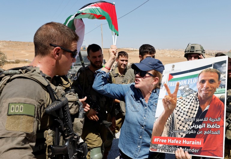 A protester argues with an Israeli army soldier. 