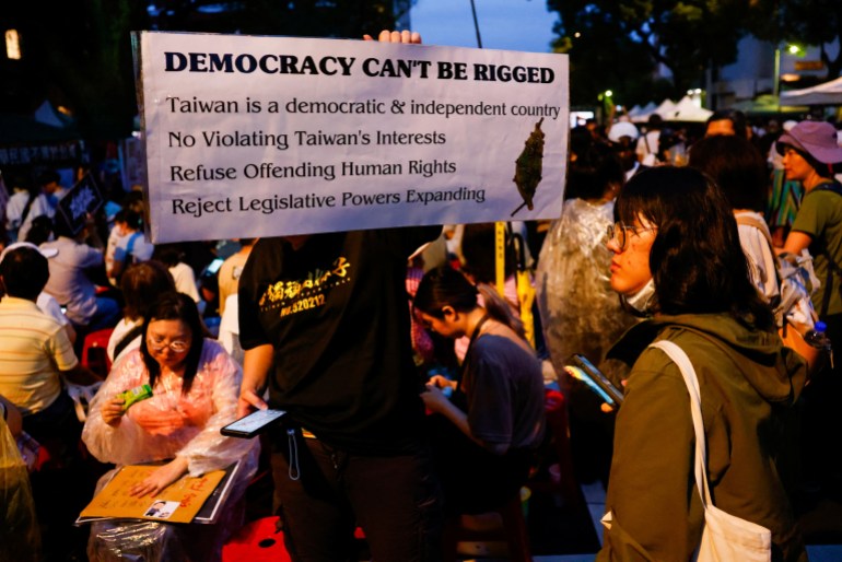 People gather outside as the parliament is in session in Taipei, Taiwan May 24, 2024. REUTERS/Ann Wang