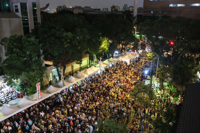 People gather outside the parliament in Taipei, Taiwan May 28, 2024. REUTERS/Ann Wang