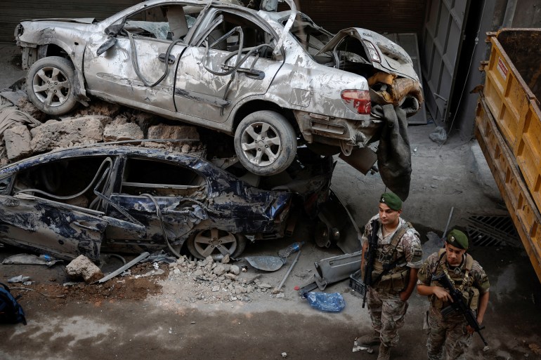 Lebanese army members patrol at the site of an Israeli air strike, amid ongoing hostilities between Hezbollah and Israeli forces, in Beirut, Lebanon, October 11, 2024. REUTERS/Louisa Gouliamaki