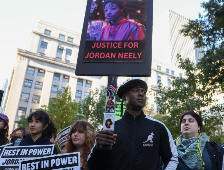 Protesters gather outside the Manhattan Criminal Court on of the first day of former U.S. Marine Daniel Penny’s trial for the death of Jordan Neely, a man whose death has been ruled a homicide by the city's medical examiner after being placed in a chokehold on a subway train, in New York City, U.S., in New York City, U.S., October 21, 2024. REUTERS/Caitlin Ochs