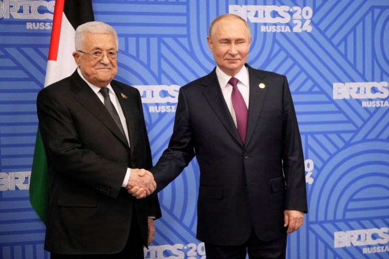 Russian President Vladimir Putin, right, greets Palestinian President Mahmoud Abbas during their meeting on the sidelines of BRICS Summit in Kazan, Russia, Thursday, Oct. 24, 2024. Alexander Zemlianichenko/Pool via REUTERS