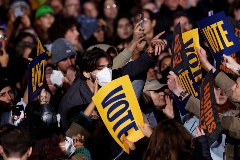 Demonstrators shout as Harris holds a campaign rally