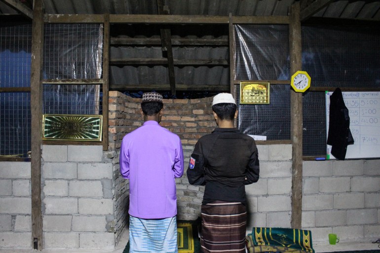 Fighters in 3rd Company pray at the mosque in their main camp in southern Myanmar.