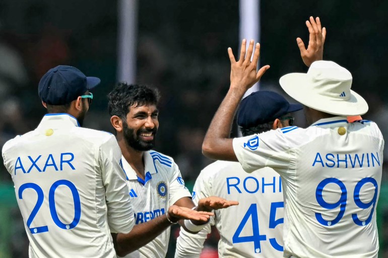 India's Jasprit Bumrah (2L) celebrates with teammates after taking the wicket of Bangladesh's Mehidy Hasan Miraz during the fifth and final day of the second Test cricket match between India and Bangladesh at the Green Park Cricket Stadium in Kanpur on October 1, 2024. (Photo by Money SHARMA / AFP) / -- IMAGE RESTRICTED TO EDITORIAL USE - STRICTLY NO COMMERCIAL USE --