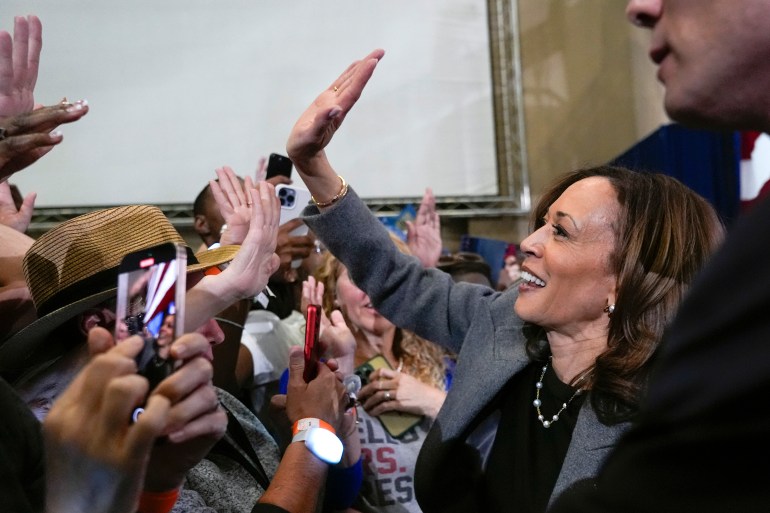 Kamala Harris gives a supporter a high-five in Atlanta.