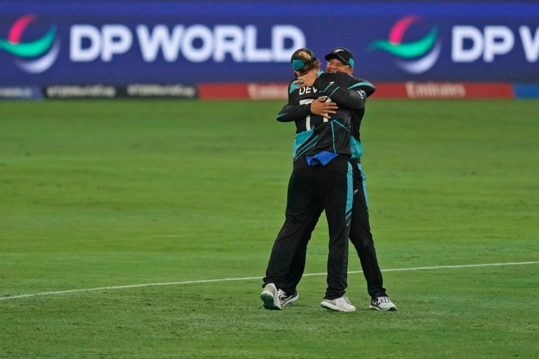 New Zealand's captain Sophie Devine, left, and teammate Suzie Bates celebrate after winning the ICC Women's T20 World Cup 2024 final match against South Africa at Dubai, United Arab Emirates, Sunday, Oct. 20, 2024. (AP Photo/Altaf Qadri)