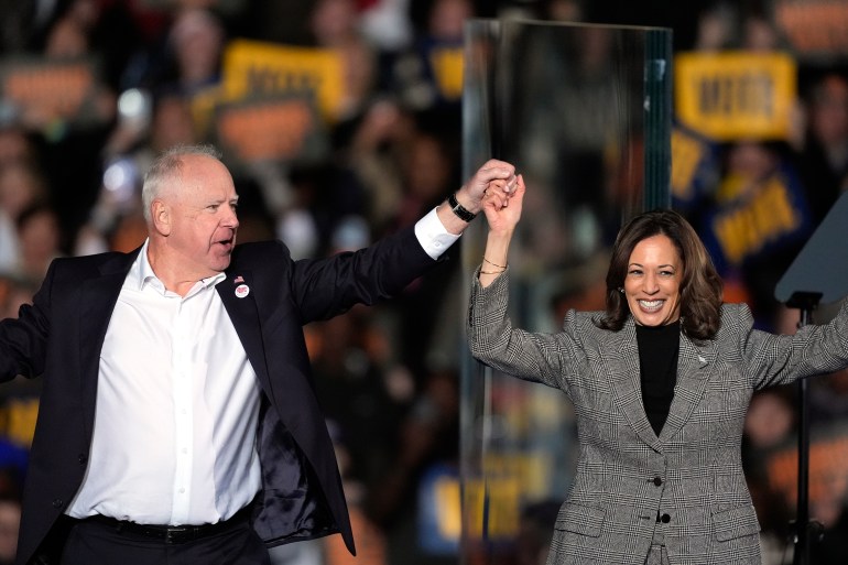 Kamala Harris and Tim Walz on stage together in Michigan