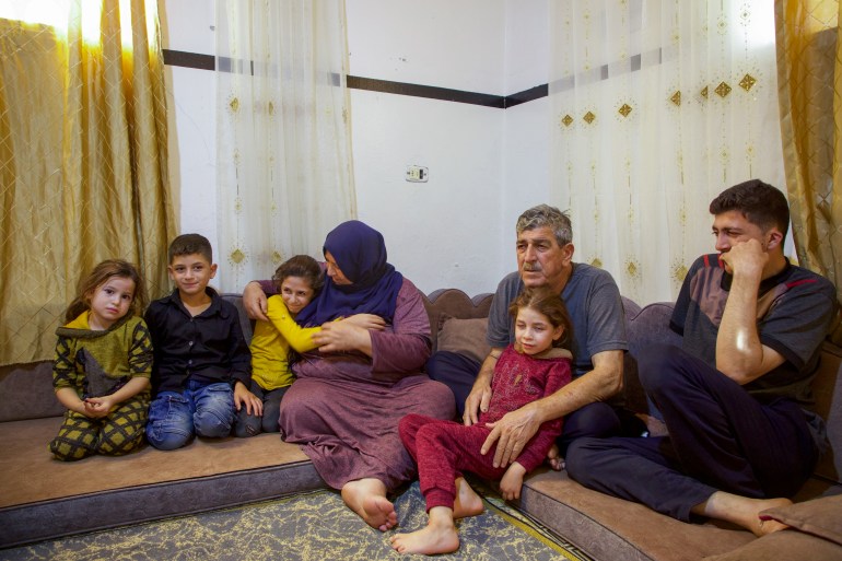 Mariam Al-Qassem and Omar Mohammed Saleh Fadiel with their grandkids 