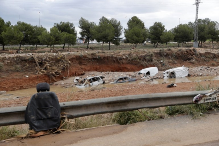 epa11698483 A view of damaged cars semi-buried in a ravine after the flash floods that occurred on 29 October in Valencia, eastern Spain, 03 November 2024. Rains have left more than 200 dead, an undetermined number of missing people, and widespread damage, especially in the province of Valencia. Thousands of volunteers are helping in a day that culminates in the largest deployment of military and security forces personnel in peacetime, according to the Spanish prime minister. EPA-EFE/Manuel Bruque