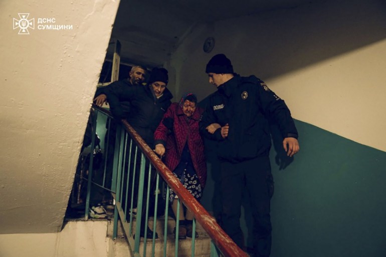 epa11726609 A handout photo released by the press service of the State Emergency Service of Ukraine shows Ukrainian rescuers escort local people at the site of a rocket hit on a residential building in Sumy, Ukraine, 17 November 2024. At least 10 people were killed, including two children, and 51 others were injured during the evening rocket attack a nine-storey residential building according the State Emergency Service (SES) of Ukraine. Russian troops entered Ukrainian territory on 24 February 2022, starting a conflict that has provoked destruction and a humanitarian crisis. EPA-EFE/STATE EMERGENCY SERVICE HANDOUT 69086HANDOUT EDITORIAL USE ONLY/NO SALES