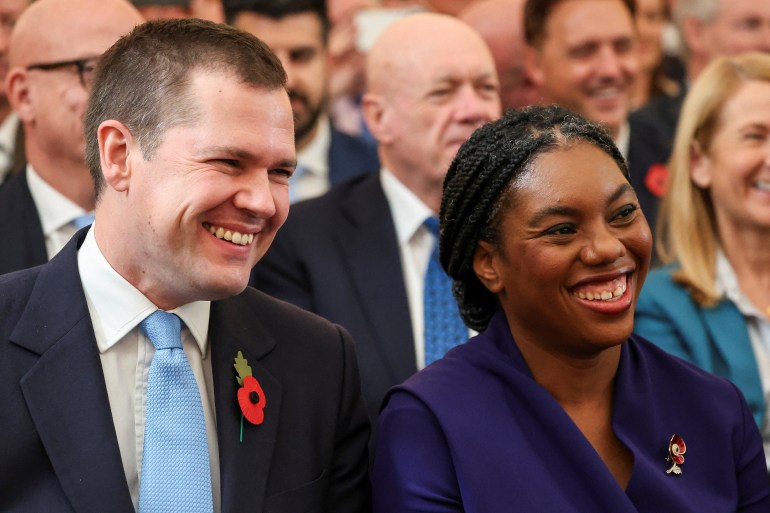 Kemi Badenoch sits next to Robert Jenrick