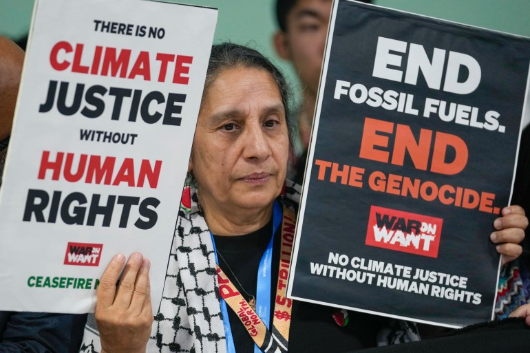 An activist demonstrates for climate justice and a ceasefire for Gaza