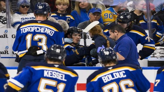 Blues’ Dylan Holloway takes puck to neck, in stable condition after being stretchered off