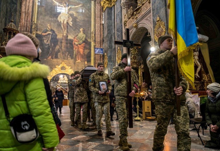 soldiers carry a coffin in an ornate church