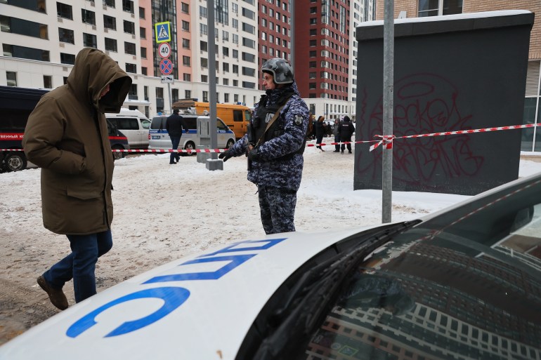 epa11781887 A police officer stands guard near a scene of an explosion in Moscow, Russia 17 December 2024. According to a statement by the Investigative Committee of Russia, Lieutenant General Igor Kirillov and his assistant were killed in a blast outside of an apartment building in Moscow. The committee's statement said the explosive was hidden inside of an electric scooter. EPA-EFE/YURI KOCHETKOV