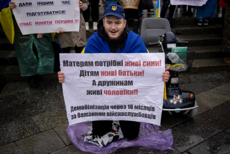 A Ukrainian war veteran with the callsign Grizzly attends a protest calling for legislation regulating the length of active military duty and the frequency of frontline rotation in Kyiv, amid Russia's attack on Ukraine, November 12, 2023. REUTERS/Thomas Peter