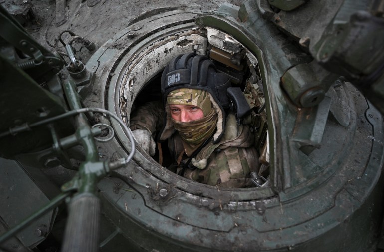 A Russian contract soldier undergoes training in a T-72 tank during military drills held at a firing range amid Russia-Ukraine conflict, in the southern Krasnodar region, Russia, December 2, 2024. REUTERS/Sergey Pivovarov