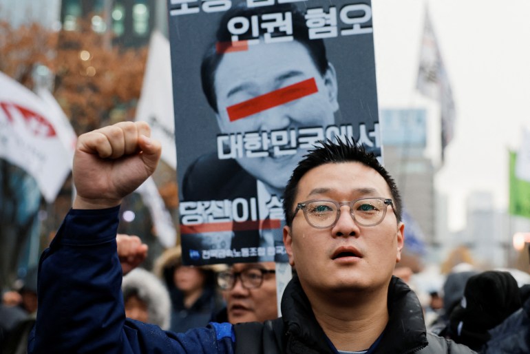 A protester attends a rally to condemn South Korean President Yoon Suk Yeol's surprise declarations of the failed martial law and to call for his resignation in Seoul, South Korea, December 5, 2024. REUTERS/Kim Kyung-Hoon