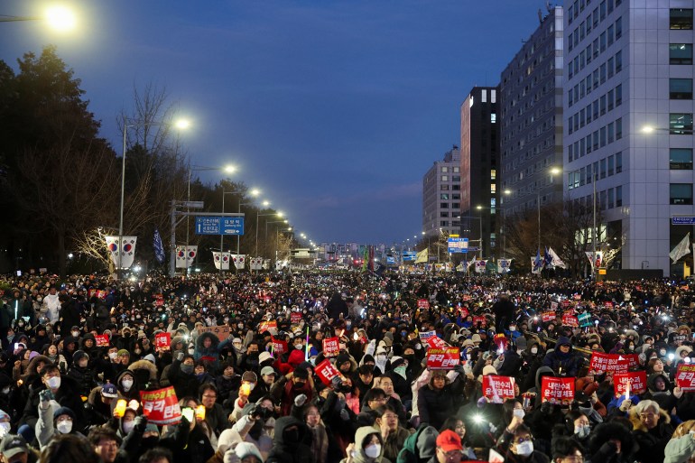 Protesters gather to take part in a rally calling for the impeachment of South Korean President Yoon Suk Yeol, who declared martial law