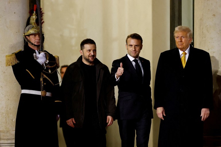 French President Emmanuel Macron accompanies U.S. President-elect Donald Trump and Ukraine's President Volodymyr Zelenskiy after a trilateral meeting at the Elysee Palace in Paris as part of ceremonies to mark the reopening of the Notre-Dame de Paris Cathedral, five-and-a-half years after a fire ravaged the Gothic masterpiece, France, December 7, 2024. REUTERS/Christian Hartmann TPX IMAGES OF THE DAY