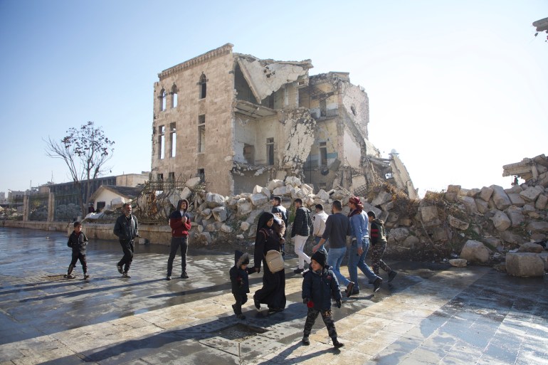 Destroyed buildings facing the Aleppo Citadel [Ali Haj Suleiman/Al Jazeera]