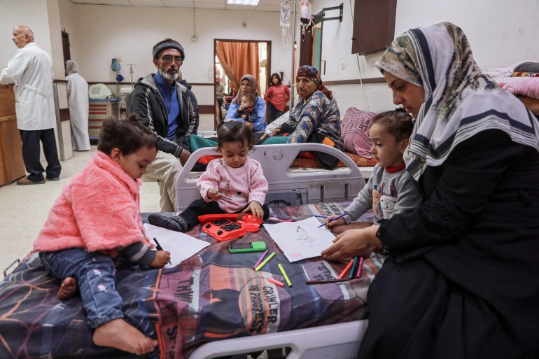 Shefa does her best to keep the girls in good spirits after an Israeli bomb destroyed their legs and killed their mother, in Gaza