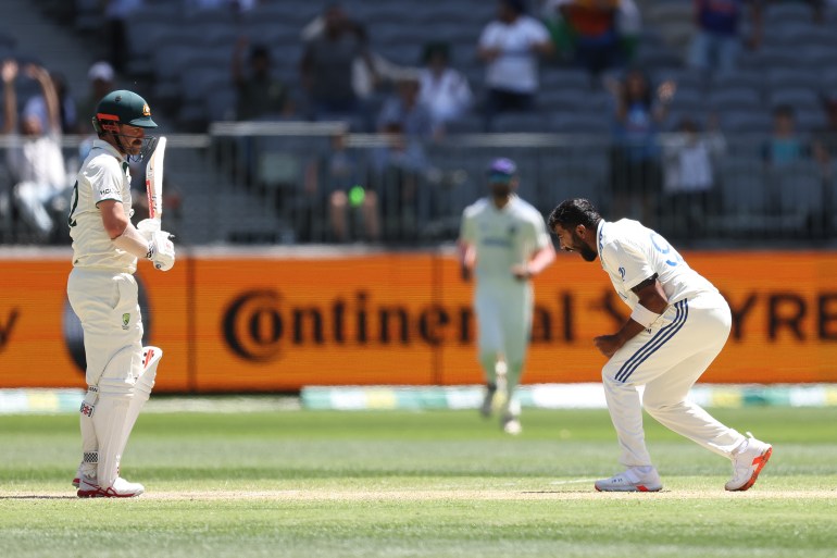 PERTH, AUSTRALIA - NOVEMBER 25: Jasprit Bumrah of India celebrates the wicket of Travis Head of Australia during day four of the First Test match in the series between Australia and India at Perth Stadium on November 25, 2024 in Perth, Australia. (Photo by Paul Kane - CA/Cricket Australia via Getty Images)