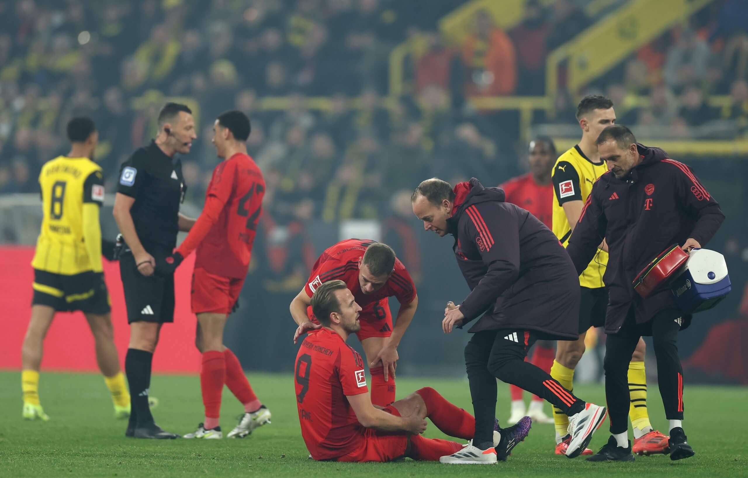 Kane went off in the 33rd minute of Bayern's draw at Dortmund (Lars Baron/Getty Images)